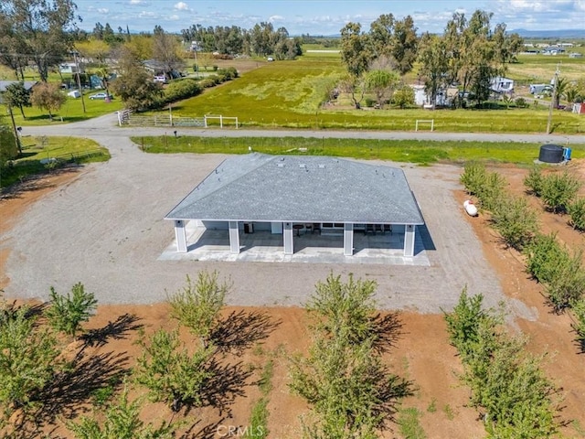 birds eye view of property with a rural view