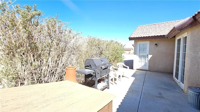 view of patio with a grill