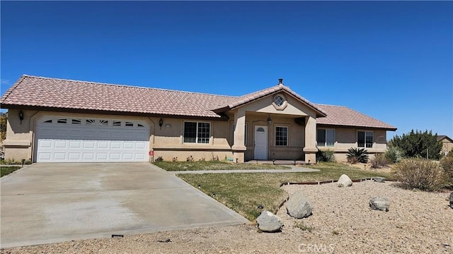 ranch-style home with a garage, stucco siding, a tiled roof, and concrete driveway