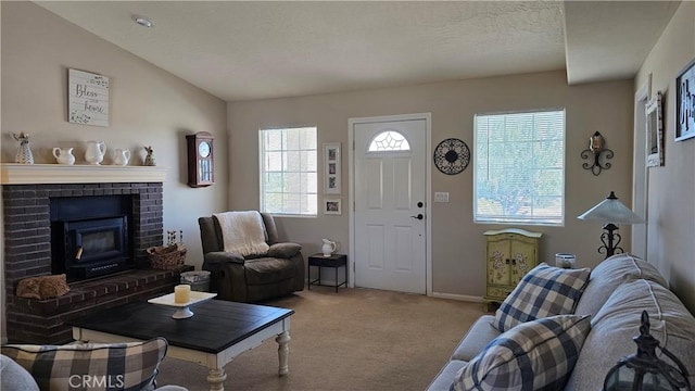 carpeted living area with a fireplace and baseboards
