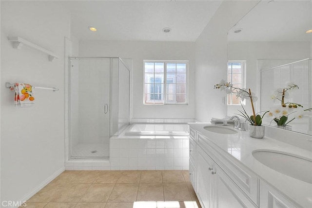 2925 E Via Terrano, Ontario, CA 91764 - bathroom with tile patterned floors, a stall shower, a bath, double vanity, and recessed lighting