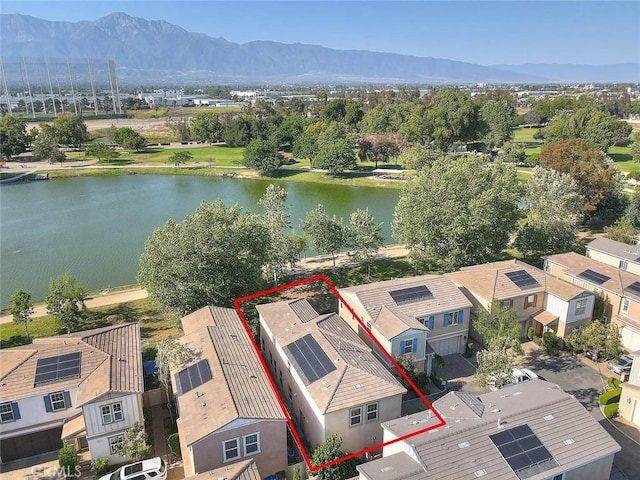 2925 E Via Terrano, Ontario, CA 91764 - aerial perspective of suburban area with property boundaries highlighted and a water and mountain view