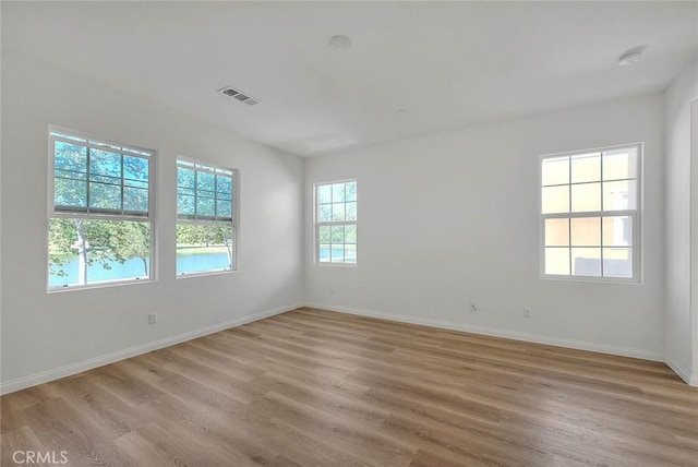 2925 E Via Terrano, Ontario, CA 91764 - spare room with light wood-style floors, baseboards, and a smoke detector