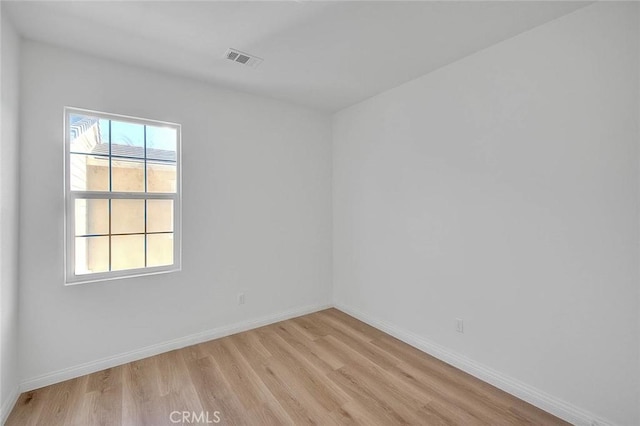 2925 E Via Terrano, Ontario, CA 91764 - spare room featuring light wood-style flooring and baseboards