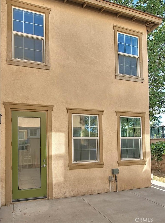 2925 E Via Terrano, Ontario, CA 91764 - entrance to property with stucco siding and a patio