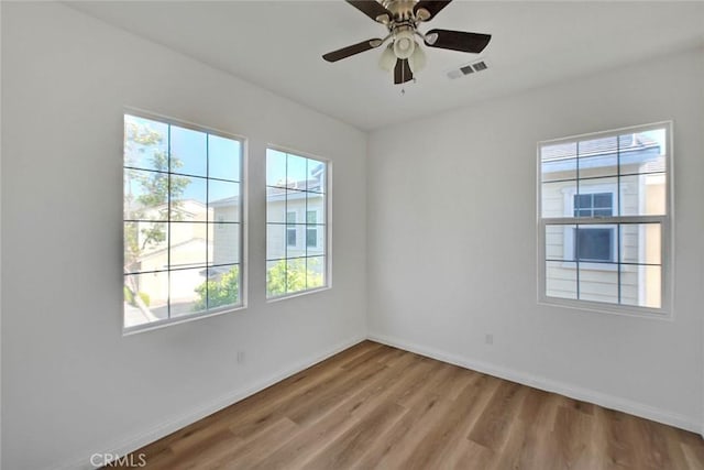 2925 E Via Terrano, Ontario, CA 91764 - unfurnished room with wood finished floors, baseboards, and ceiling fan