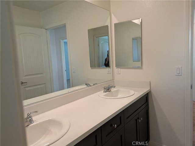 bathroom featuring double vanity and a sink