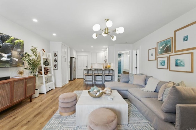 1562 Camino Del Mar Unit 639, Del Mar, CA 92014 - living room with light wood-type flooring, a chandelier, and recessed lighting