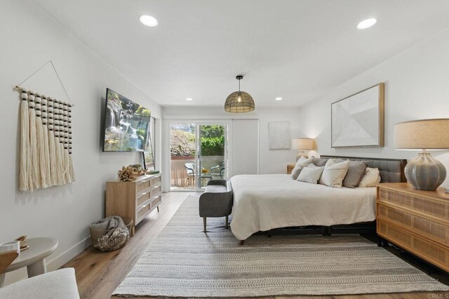1562 Camino Del Mar Unit 639, Del Mar, CA 92014 - bedroom featuring access to exterior, wood finished floors, and recessed lighting