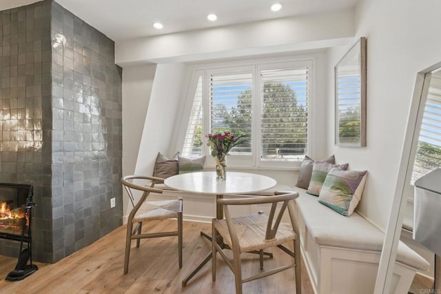 1562 Camino Del Mar Unit 639, Del Mar, CA 92014 - dining room with light wood-style flooring, healthy amount of natural light, recessed lighting, and a fireplace