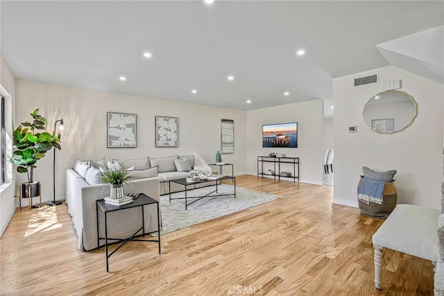 living area featuring visible vents, recessed lighting, light wood-style floors, and baseboards