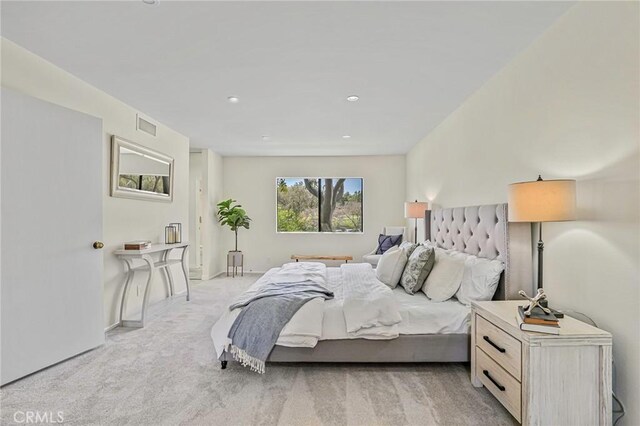 bedroom featuring visible vents, recessed lighting, baseboards, and light colored carpet