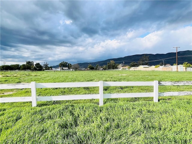 1380 Cottonwood Ave, San Jacinto, CA 92582 - view of yard featuring a mountain view, fence, and a rural view