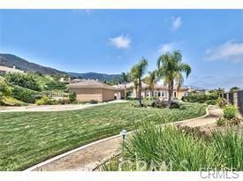 4069 Nancy Cir, Corona, CA 92881 - view of home's community with a mountain view and a lawn