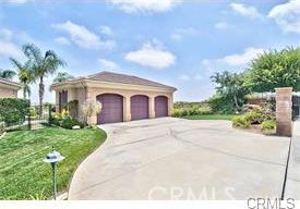 4069 Nancy Cir, Corona, CA 92881 - mediterranean / spanish home featuring driveway and an attached garage