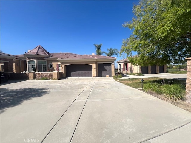 4069 Nancy Cir, Corona, CA 92881 - ranch-style house with an attached garage, driveway, a tiled roof, and stucco siding