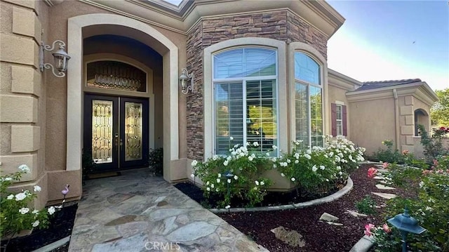 4069 Nancy Cir, Corona, CA 92881 - doorway to property featuring french doors, stucco siding, and stone siding