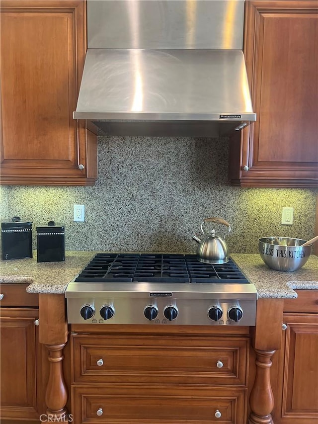 4069 Nancy Cir, Corona, CA 92881 - kitchen featuring wall chimney range hood, stainless steel gas stovetop, brown cabinetry, and backsplash