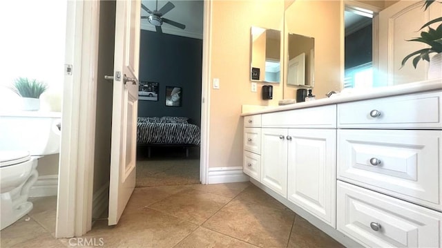 4069 Nancy Cir, Corona, CA 92881 - bathroom with vanity, toilet, a ceiling fan, tile patterned flooring, and ornamental molding