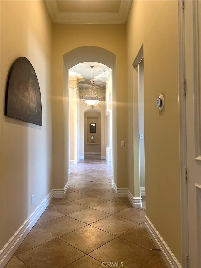 4069 Nancy Cir, Corona, CA 92881 - hallway with arched walkways, crown molding, and baseboards