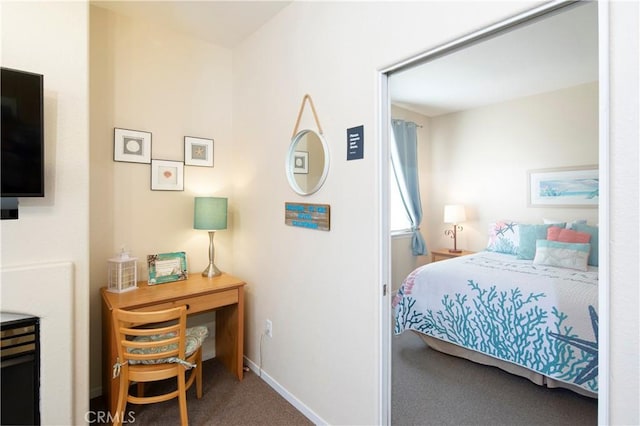 carpeted bedroom with baseboards