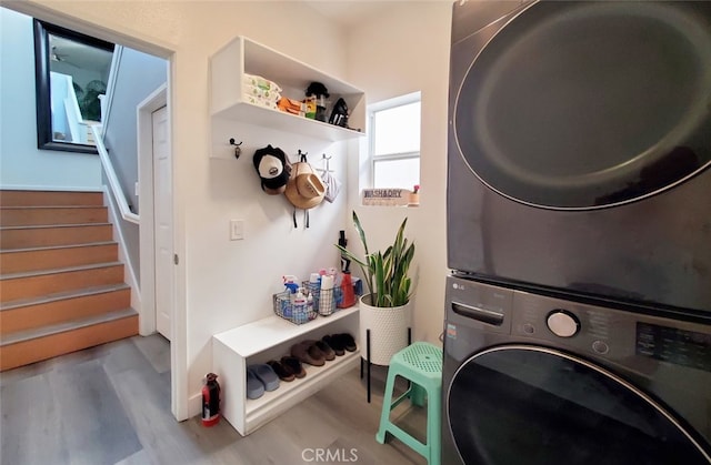 11102 Avolencia Pl, Garden Grove, CA 92840 - laundry area with stacked washer and clothes dryer and wood finished floors