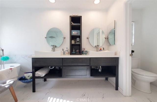 11102 Avolencia Pl, Garden Grove, CA 92840 - full bath featuring marble finish flooring, double vanity, a freestanding tub, toilet, and recessed lighting