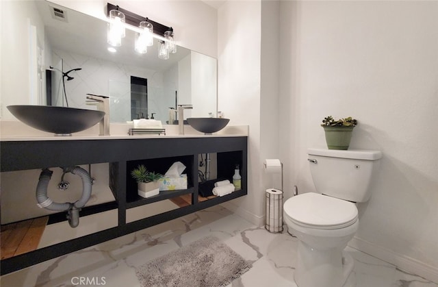 11102 Avolencia Pl, Garden Grove, CA 92840 - full bath featuring marble look tile flooring, baseboards, and toilet