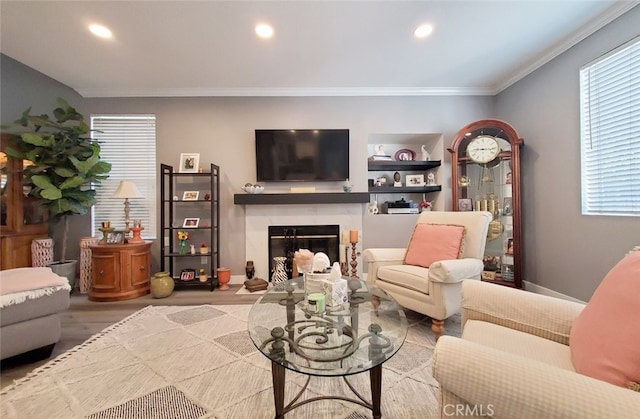 11102 Avolencia Pl, Garden Grove, CA 92840 - living area with plenty of natural light, crown molding, a high end fireplace, recessed lighting, and wood finished floors