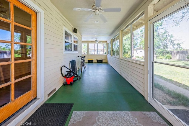sunroom with a ceiling fan
