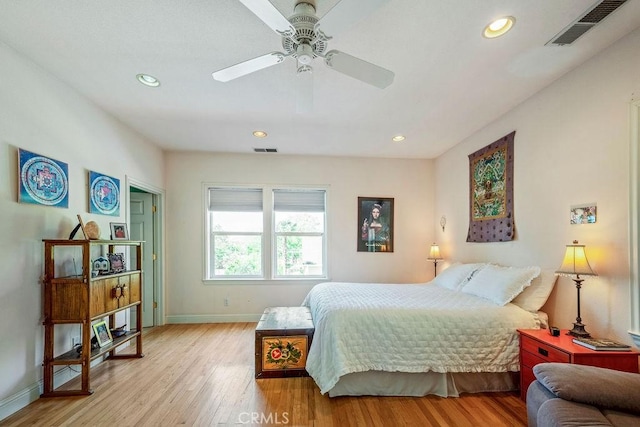 bedroom with baseboards, visible vents, and light wood-style floors