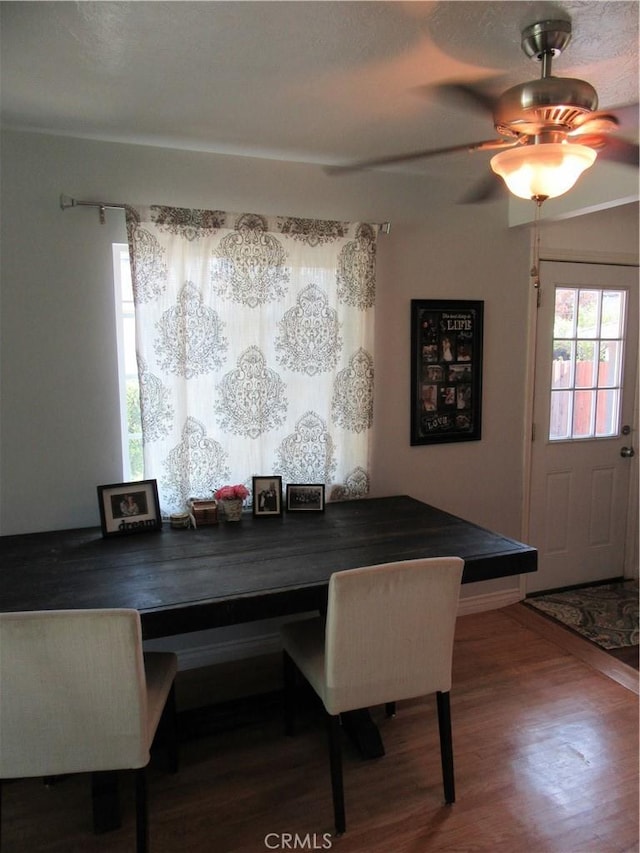 dining area with wood finished floors