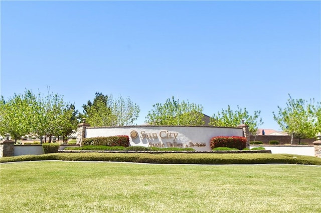 community / neighborhood sign with a lawn