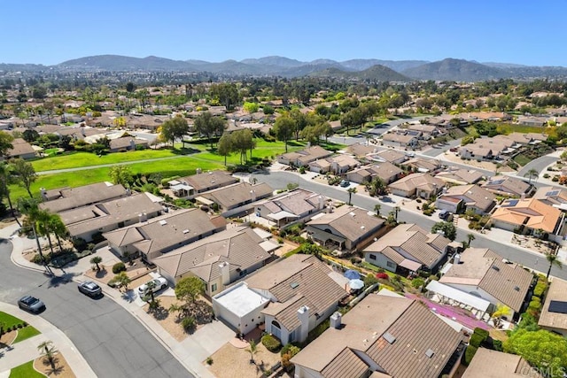 aerial view of residential area with mountains