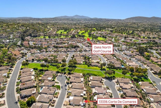 view of property location featuring nearby suburban area and mountains