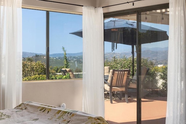 doorway to outside featuring a mountain view