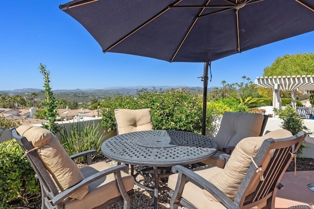 13336 Corte De Comares, San Diego, CA 92128 - view of patio / terrace featuring outdoor dining space, a pergola, and a mountain view