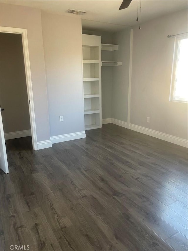 2821 Carnoustie, Ontario, CA 91761 - unfurnished bedroom featuring visible vents, baseboards, a closet, dark wood-style flooring, and a ceiling fan