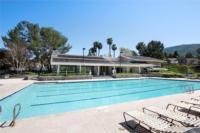 community pool featuring a mountain view
