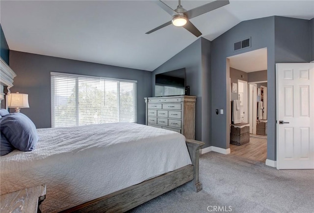 bedroom featuring ceiling fan, visible vents, light carpet, baseboards, and lofted ceiling