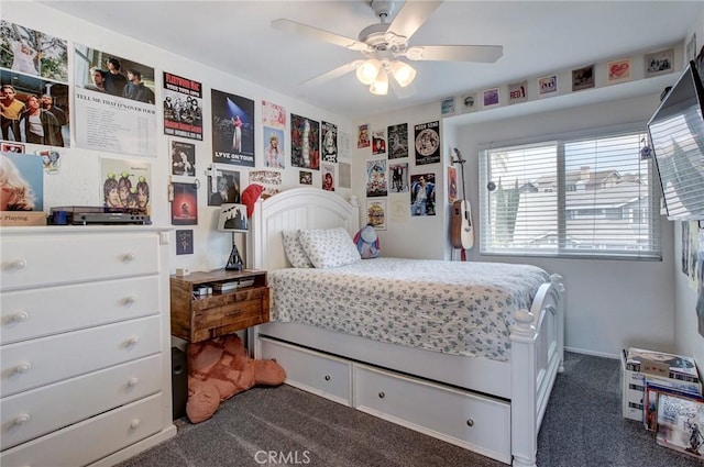 bedroom featuring ceiling fan and dark colored carpet