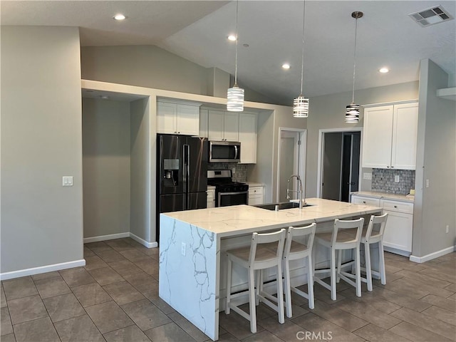 17238 Danbury Ave, Hesperia, CA 92345 - kitchen featuring white cabinetry, stainless steel appliances, a sink, an island with sink, and visible vents