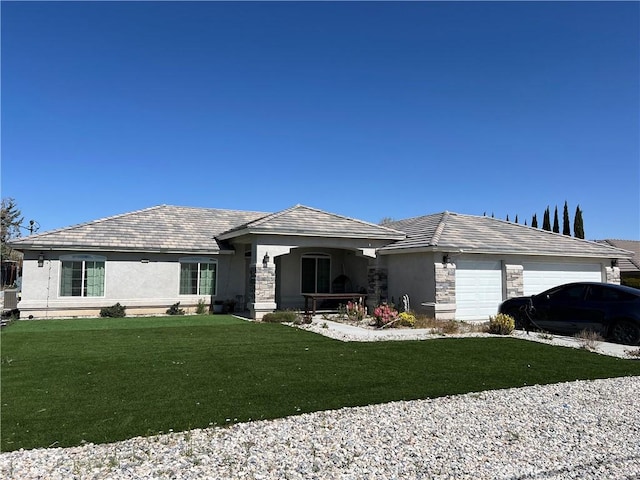 17238 Danbury Ave, Hesperia, CA 92345 - view of front of home featuring stucco siding, an attached garage, stone siding, and a front lawn