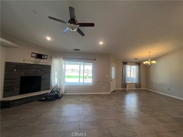 17238 Danbury Ave, Hesperia, CA 92345 - unfurnished living room with a fireplace with raised hearth, vaulted ceiling, and plenty of natural light