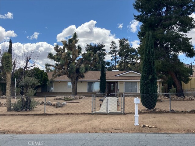 56707 Desert Gold Dr, Yucca Valley, CA 92284 - single story home with a fenced front yard and a gate