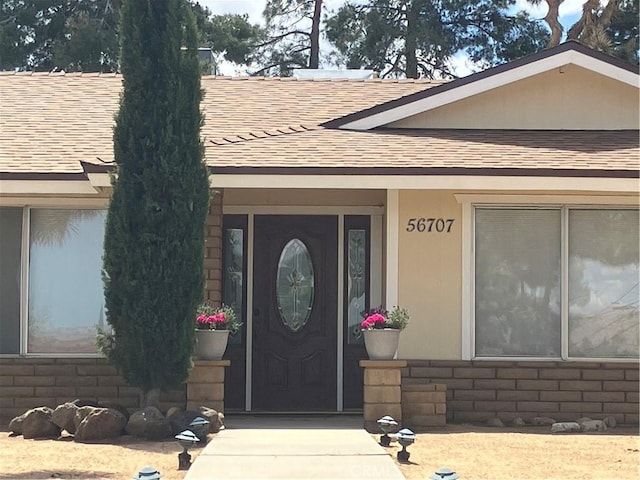 56707 Desert Gold Dr, Yucca Valley, CA 92284 - doorway to property with a shingled roof