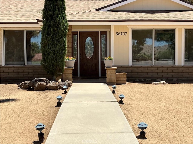 56707 Desert Gold Dr, Yucca Valley, CA 92284 - view of exterior entry featuring a shingled roof