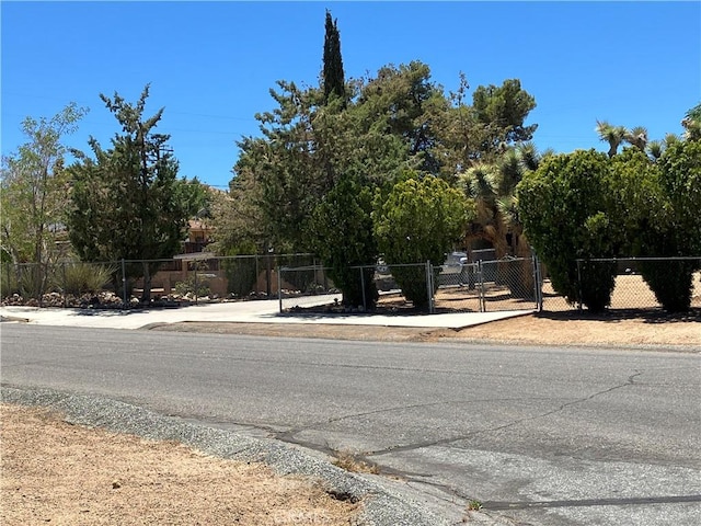 56707 Desert Gold Dr, Yucca Valley, CA 92284 - view of asphalt street featuring a gate