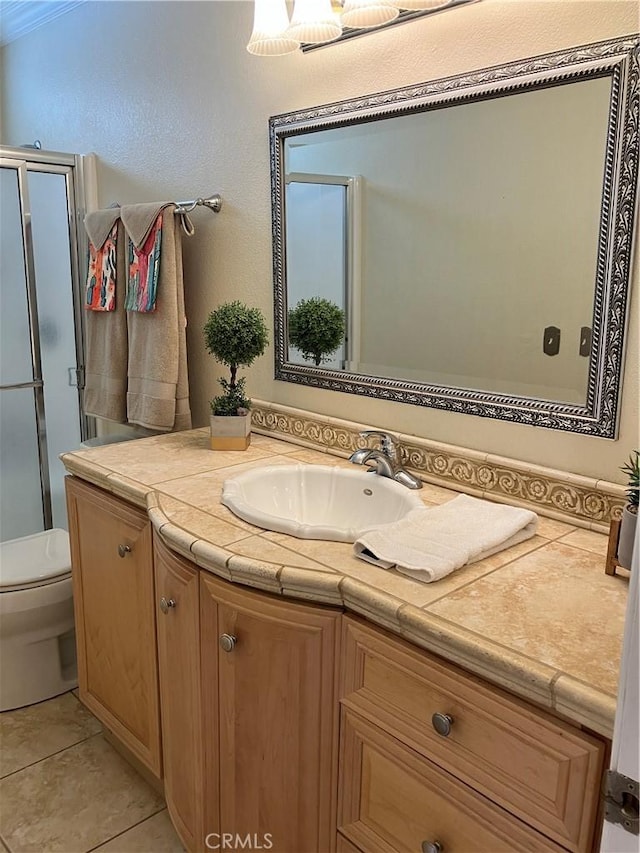 56707 Desert Gold Dr, Yucca Valley, CA 92284 - bathroom featuring vanity, a shower with shower door, and tile patterned flooring