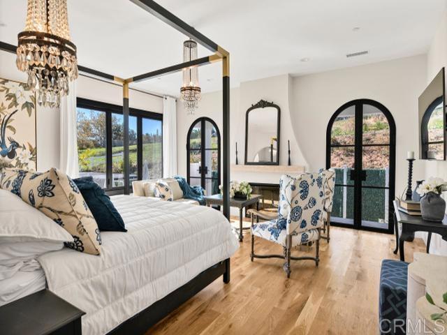 2255 Via Dulcea, Fallbrook, CA 92028 - bedroom with a chandelier and wood finished floors